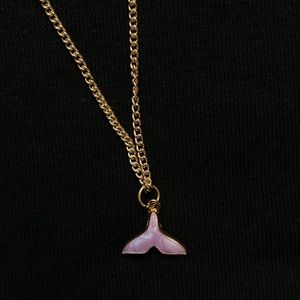 Gold whale tail necklace